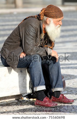LISBON, PORTUGAL - MARCH 27: Unidentified homeless man on the street of Lisbon, Portugal at March 27, 2011. Lisbon has an exact number of 1.366 homeless persons