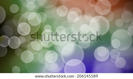 out of focus background or wallpaper of bright colours and white circles