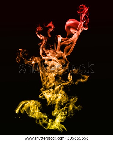 beautiful golden smoke effect with spirals of different shades and colours on a black background