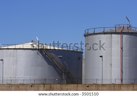 fuel tanks behind barbed wire fences