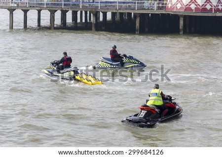 Clacton-on-sea, Essex, England UK: 26 August 2010- police on jet skis keeping people safe at sea in the summer season, when more people drown swimming.