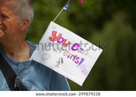 Colchester, Essex, England, UK: 21 July 2014- A man with a sign saying \