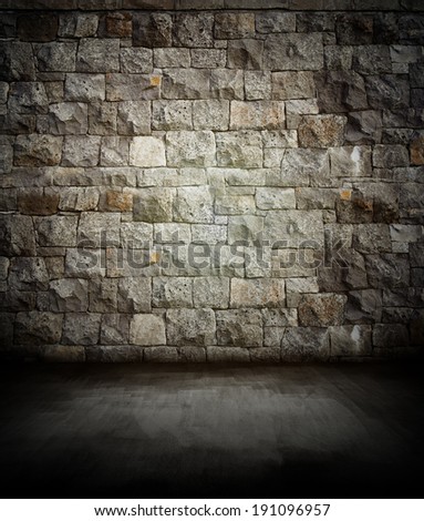 Dark floor and rock wall