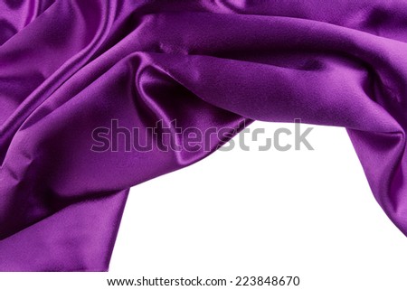 Closeup of purple silk fabric on plain background