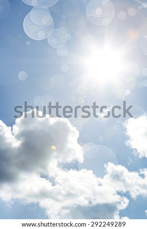 Bright sun in fluffy clouds sky
