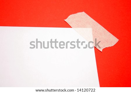 Piece of paper taped in corner to red