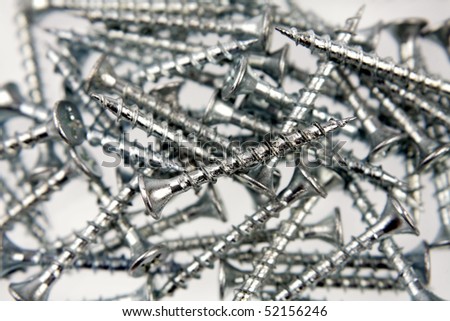 Heap of metal screws close-up