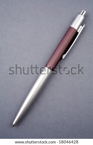 Ballpoint pen on blue background