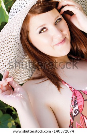 Beautiful woman wearing sunhat to protect her skin