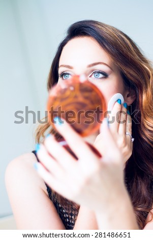 Woman cleansing her beautiful face