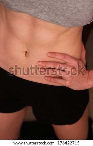 6 pack woman abs close up
