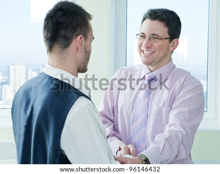 happy business mans have a lucky meet with colleague in office room