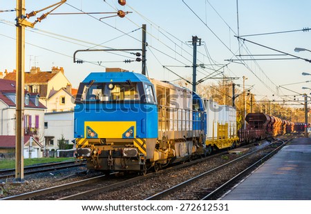 Diesel locomotive hauling a freight train at Montbeliard station - France
