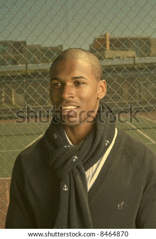 young athletic black man in a tennis court