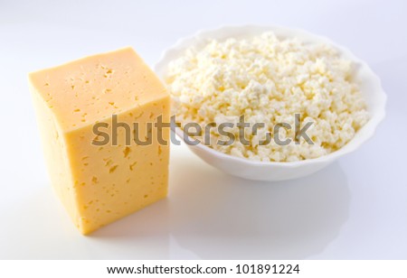 Dairy products on a white reflective background.