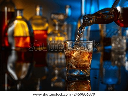 Glass of cocktail with berries and glasses served on table against white wall