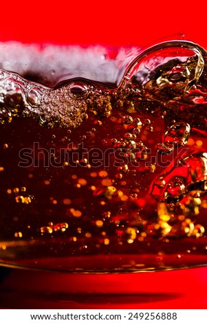 detail of an alcoholic beverage on yellow background