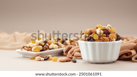 Similar – Image, Stock Photo Variation of nuts in a bowl on a beige linen tablecloth. Top view.