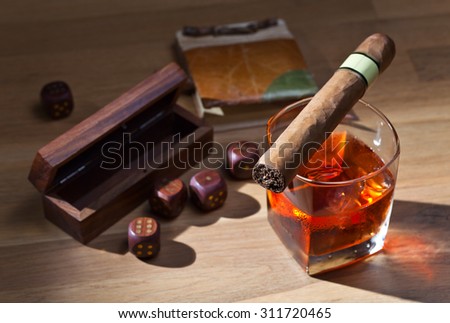 whiskey and dice on a wooden table