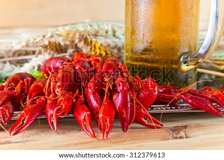 boiled crayfish with cold  beer on wooden table