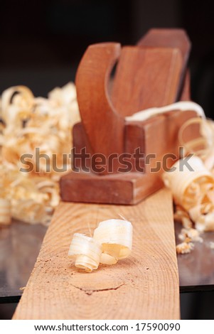 shaving and old wooden plane,focus on a foreground