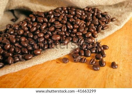 Roasted beans of coffee in a bag