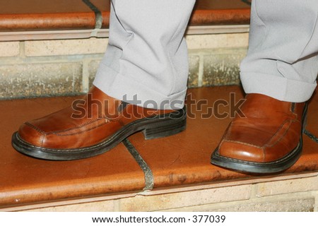 Brown leather dress shoes on a man