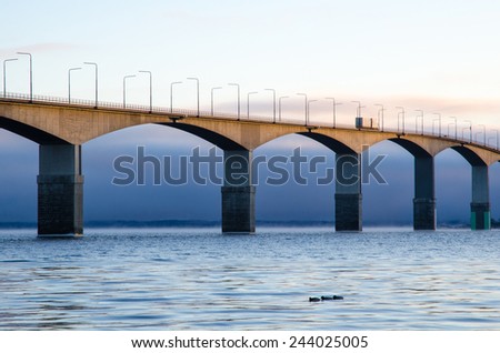The Oland bridge in Sweden in the first morning sun. The bridge is one of the longest bridges in Europe and is connecting the island Oland with mainland Sweden.