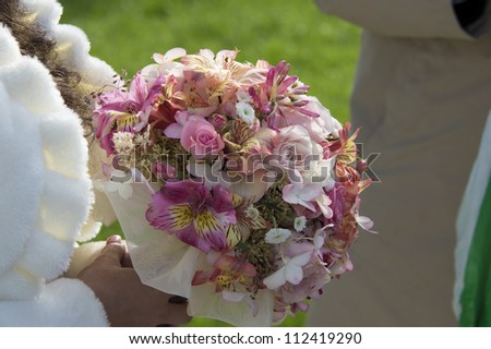 Image of bridal bouquet in bridals hands