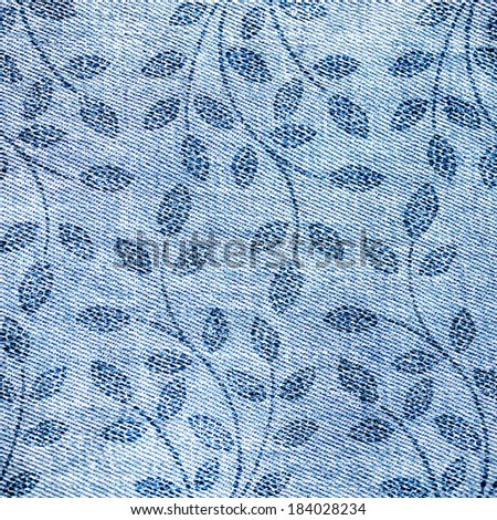 Floral background. Grunge texture with floral branches. Jeans texture.