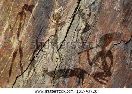 Primitive figures on the rock looks like cave painting