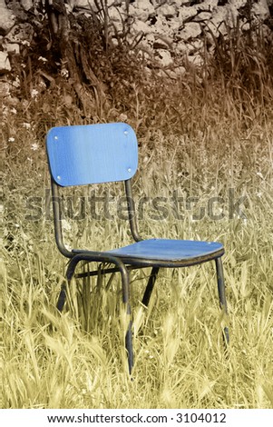 Abandoned chair in the grass in false colors.