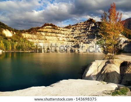 Water or pond in an abandoned open quarry or mine.