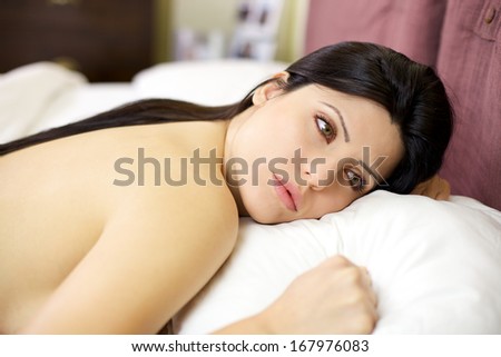 Sadness and loneliness captured young woman in bed feeling lonely