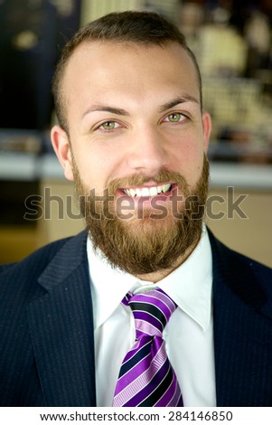 Handsome business man with green eyes smiling