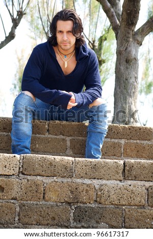 Muscular male model on stairs with sweat shirt