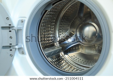 Washing machine with open door, ready for laundry.
