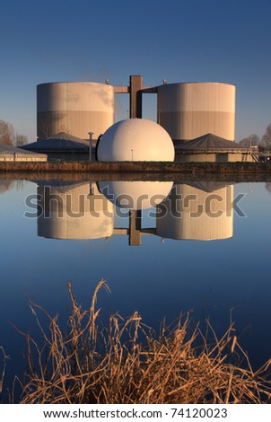 Water treatment plant in the warm light of sunrise.