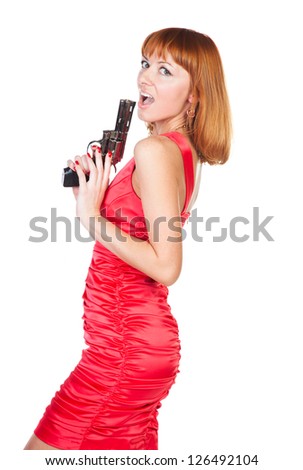 Beautiful woman in a red dress with a gun in his hand on a white background