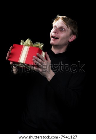 The man with a gift on a black background