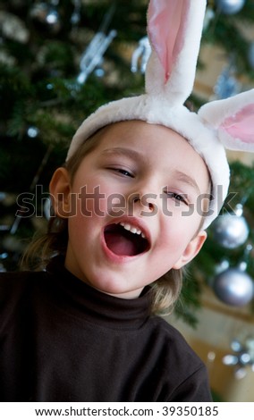 little boy in a white downy bunny costume.
