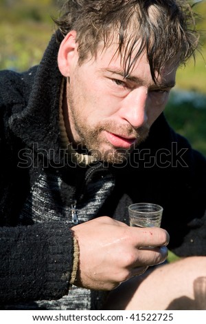 Rogue drinking vodka from a glass
