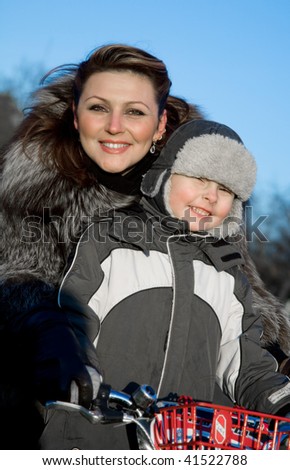 Mother playing with son in winter