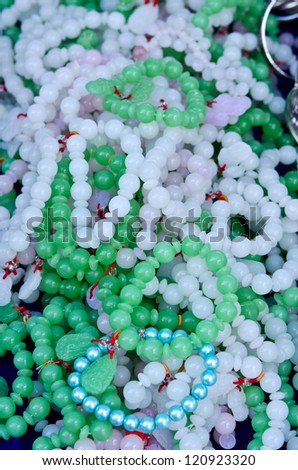 Pile of Jade and pearl Bracelet used for woman accessories jewelry decoration gem pattern in Thailand outdoor market shop in cheap prize.