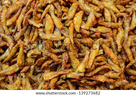 Pile of Fried Anchovies product in Thailand open market. Little fishes contain nutrition like calcium and protein which good for health.