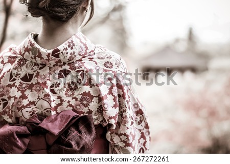 Back of a pretty Japanese girl in beautiful atmosphere in grunge style