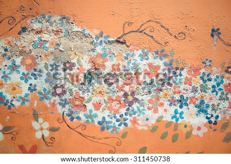 BANGKOK, THAILAND - JUNE 2: Part of vintage color flower mural painting on the crack wall in the slum of Thailand on June 2, 2015.