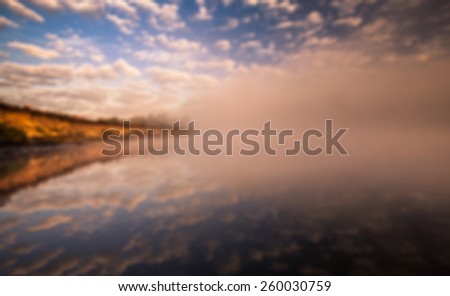 beautiful summer landscape misty morning on the river and clouds reflected in water