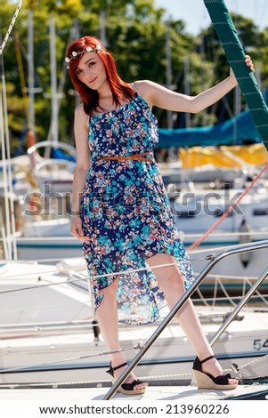 An attractive woman on a boat at a marina