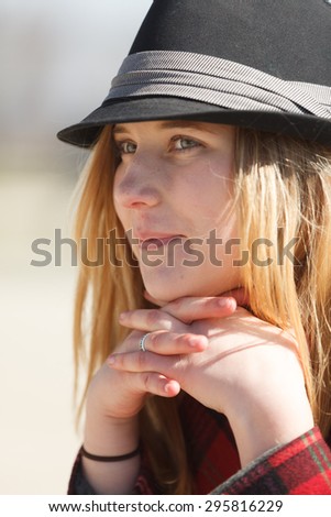 Attractive blond woman with a fedora